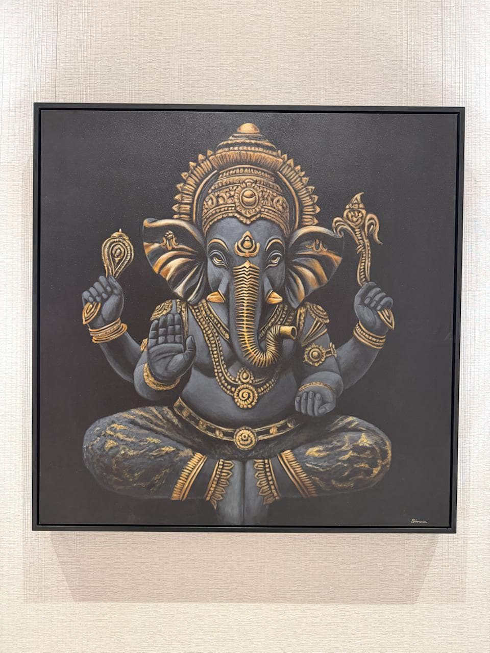 Classic Ganesha by Shimova, a framed painting of Ganesha in dark gray and gold against a black background.