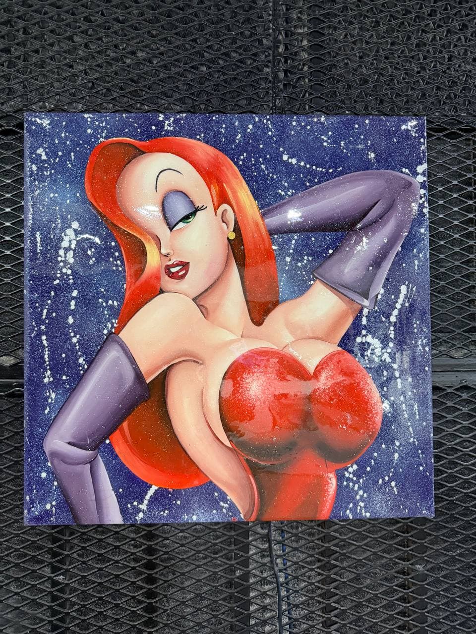 9Juane$ artwork Jessica Rabbit showing a red-haired pop-surreal female figure in a red dress and purple gloves against a splattered blue background.