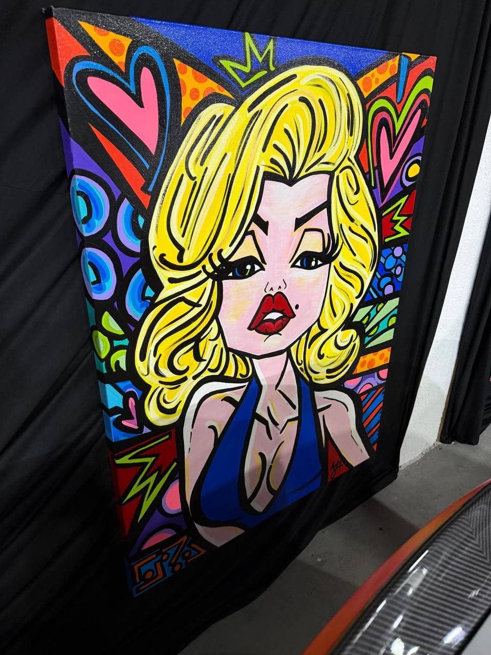 Mely G Art placeholder-titled pop portrait showing a blonde figure with red lips, hearts, crown details, circles, and saturated graphic color.