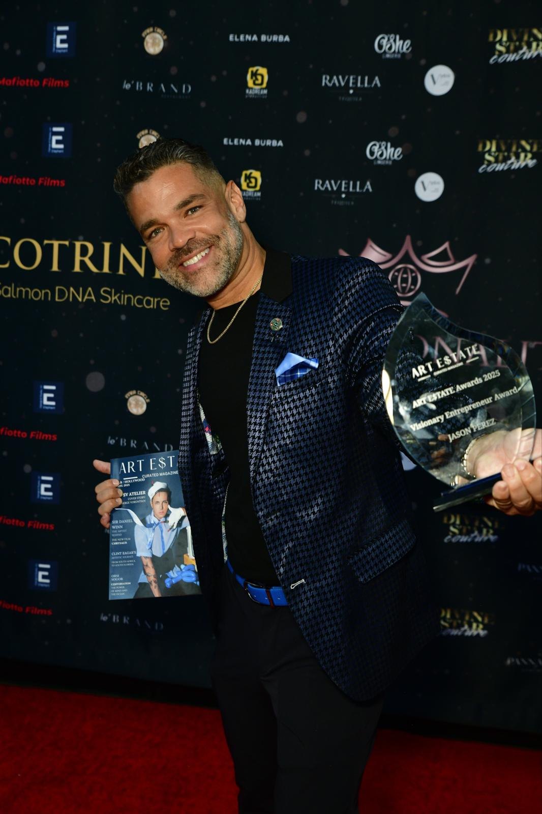 Jason Perez holding an award at an event backdrop